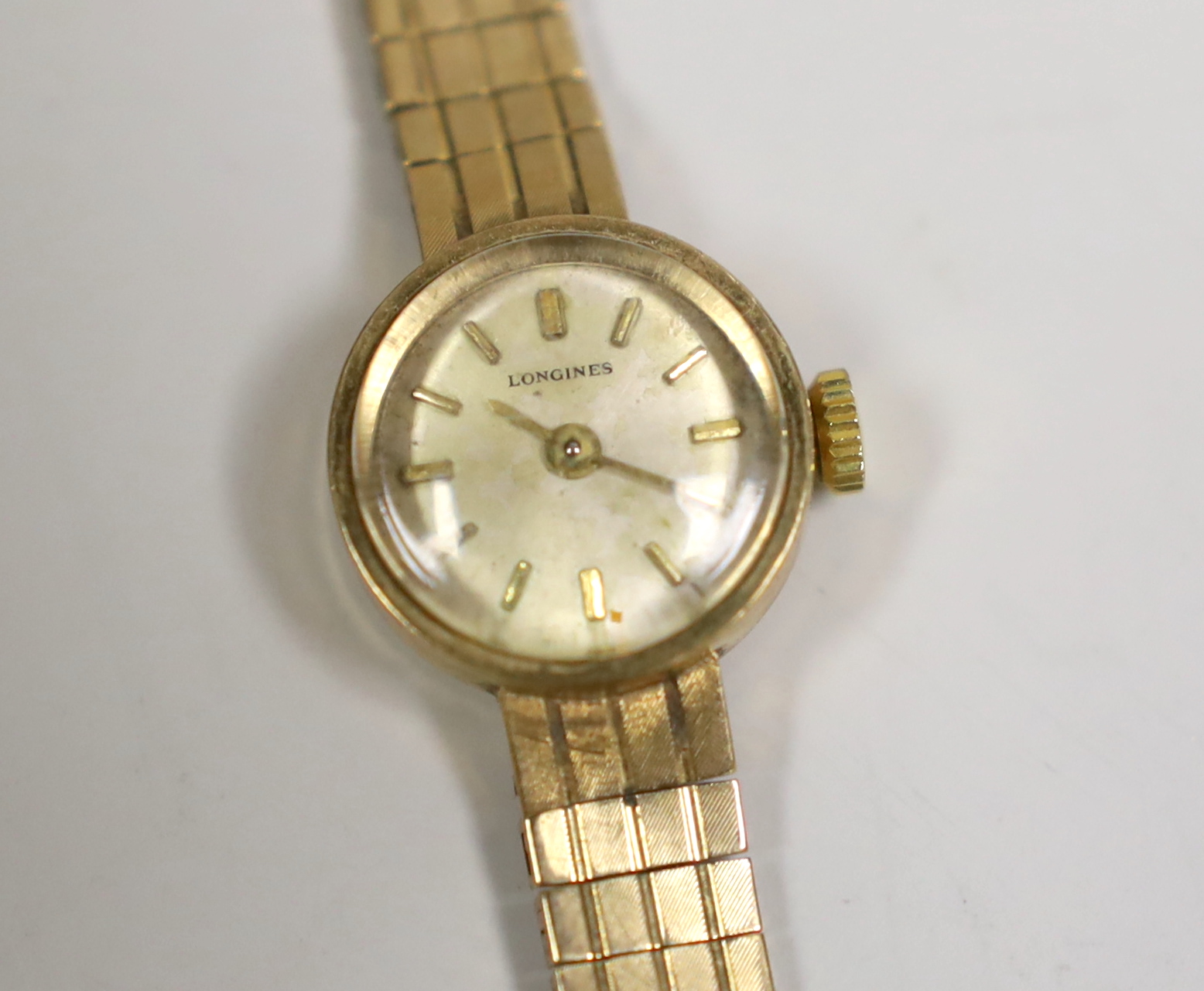 A lady's 9ct gold Longines manual wind wrist watch, 15cm, gross weight 16.5 grams, with a Longines box.